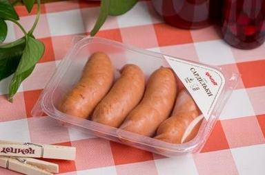 Сардельки з трьох видів м'яса в упаковці (ціна за 100г)